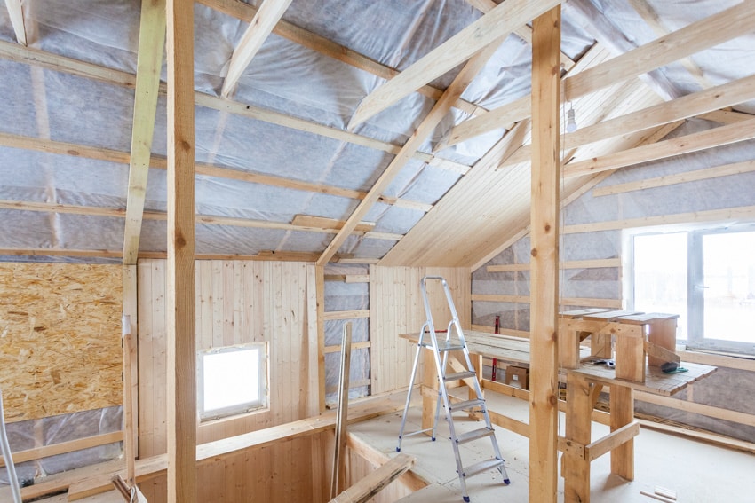 attic space with windows