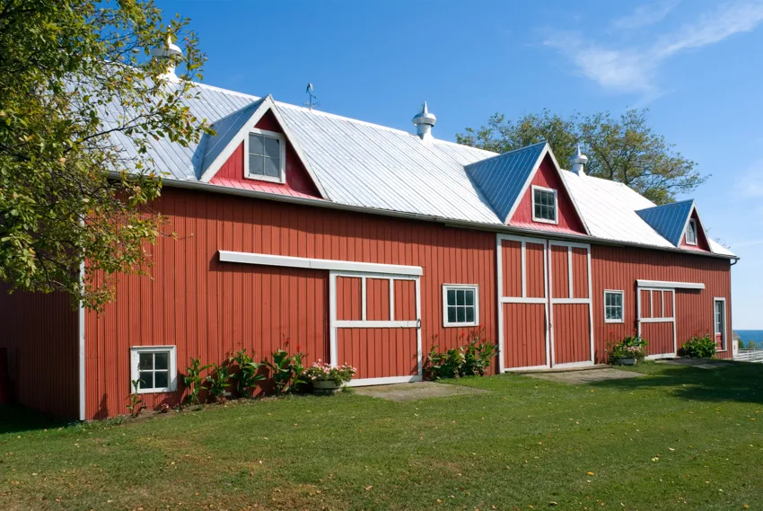 Metal siding and dormers of a barn style house 