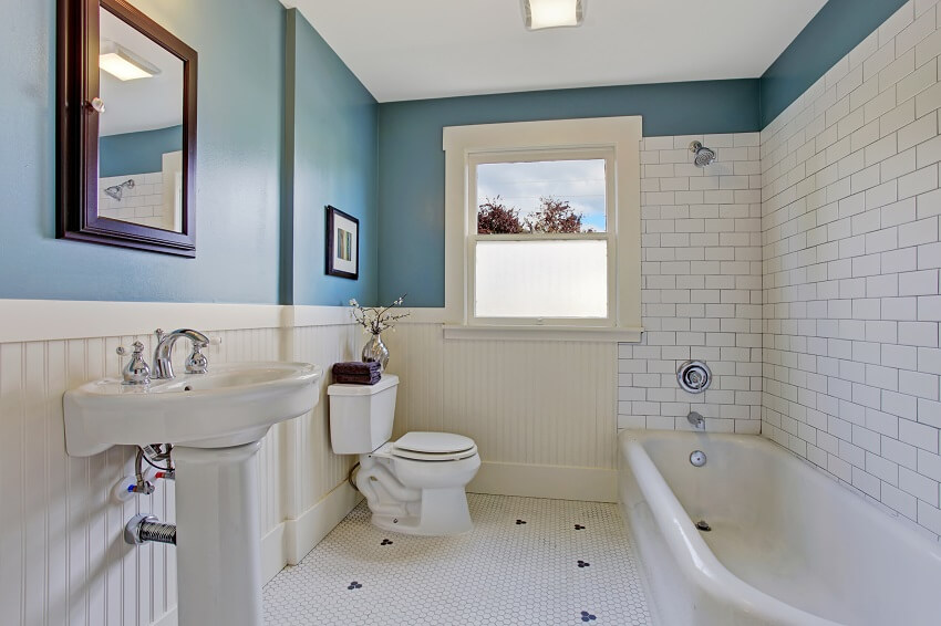 Bathroom layout with beadboard wall, blue wall and white plank panel trim 