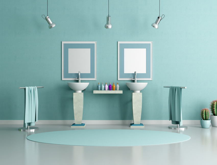 Bathroom sink on pedestals spotlights hanging from ceiling teal wall