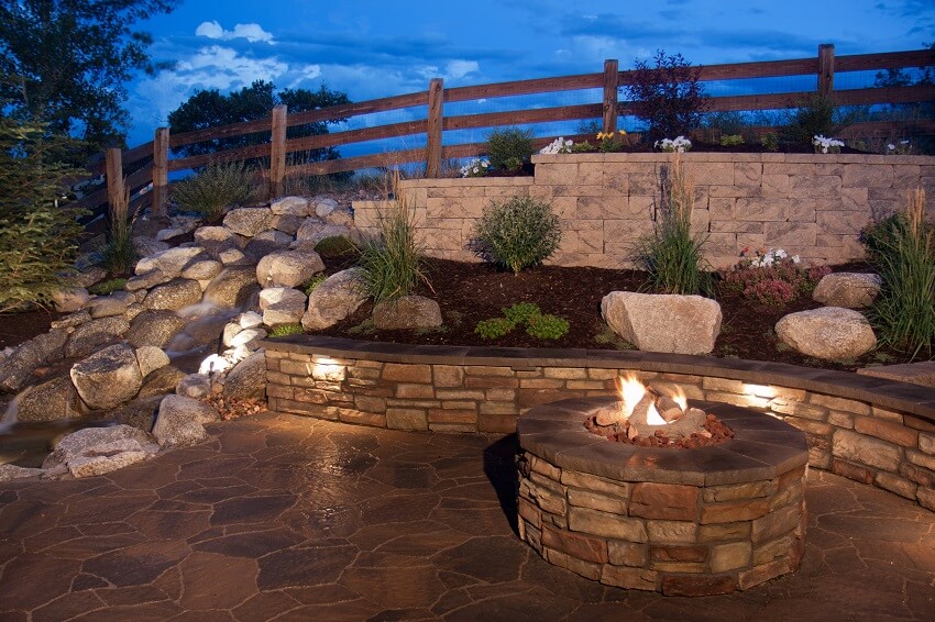Beautiful backyard fire pit seat wall and water feature