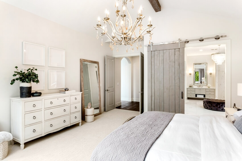 Beautiful bedroom in new luxury home with view of ensuite master bathroom