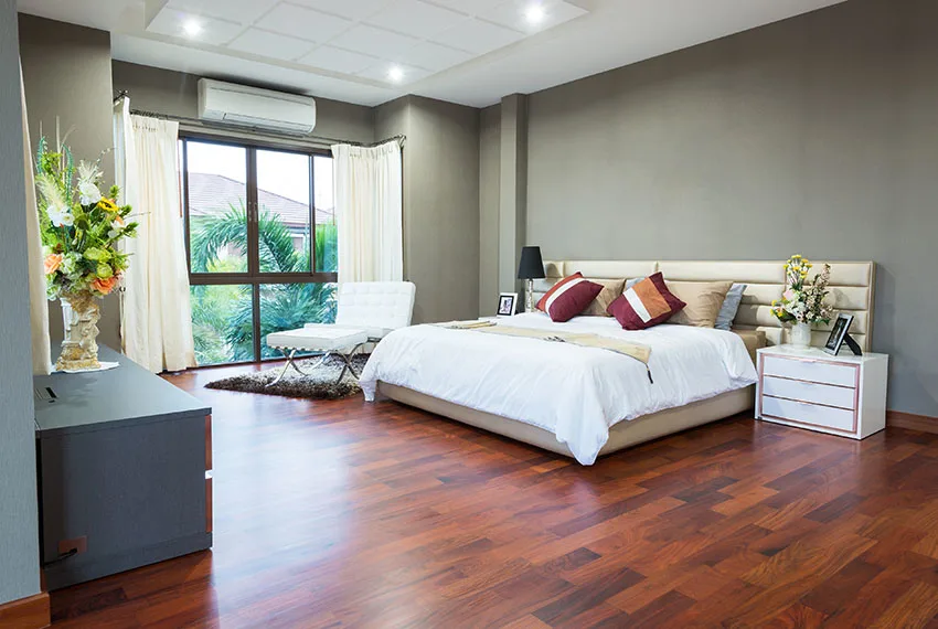 Beautiful bedroom with cherry stained acacia hardwood flooring