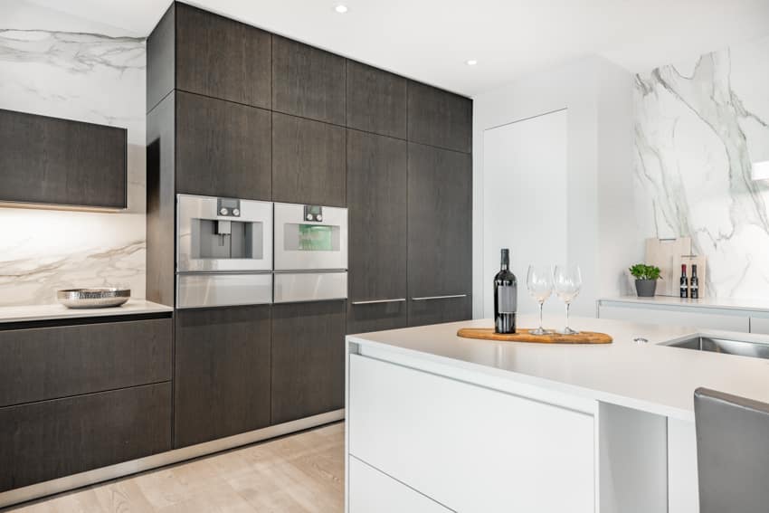 Black wood kitchen cabinets center island with countertop quartz backsplash wood floors