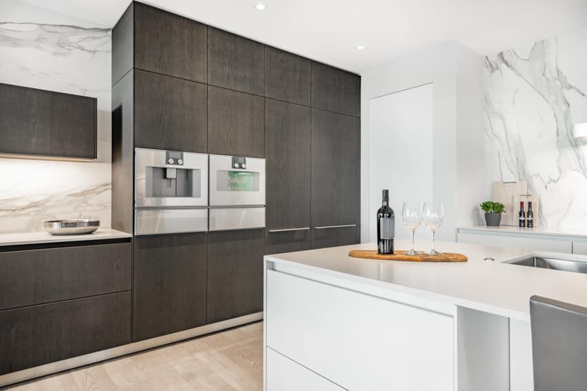 Black wood kitchen cabinets center island with countertop quartz veined backsplash 