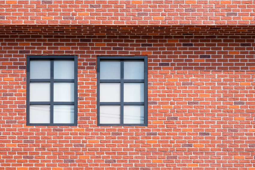 Brick house exterior black vinyl windows