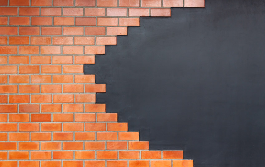 Brick facade on black wall