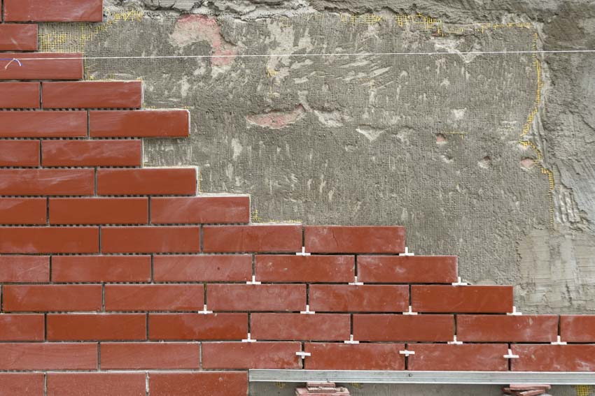 Brick veneer on concrete foundation