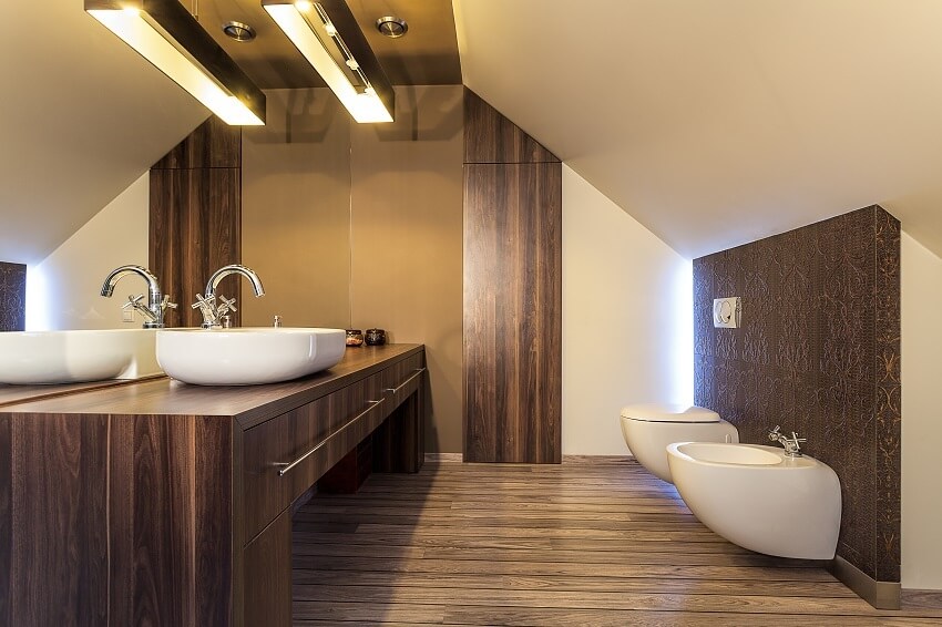 Bright bathroom on the attic with laminate panels