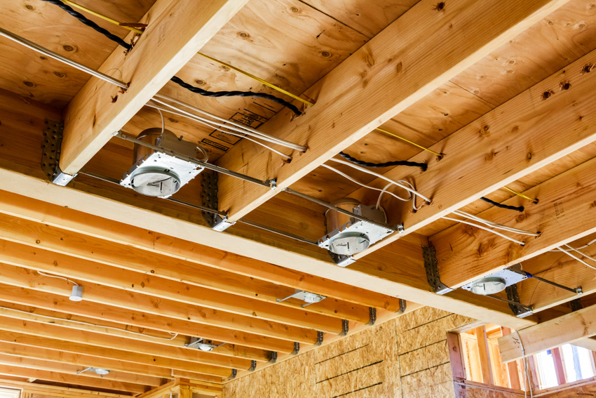 Lighting on exposed wooden ceiling