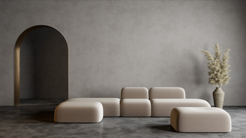 Concrete gray wall cream colored couch