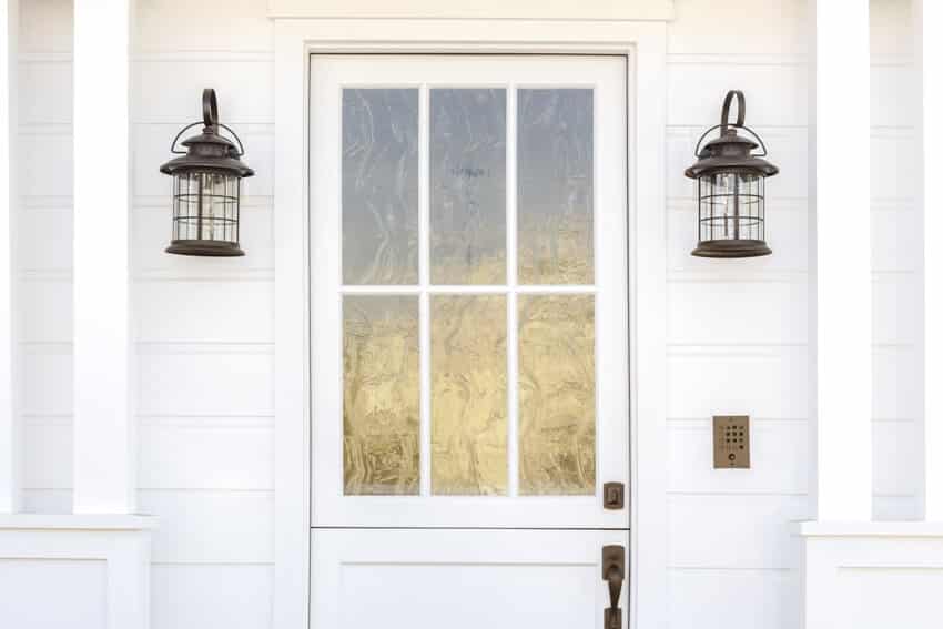 Cropped horizontal shot of a white door with glass etched detail 