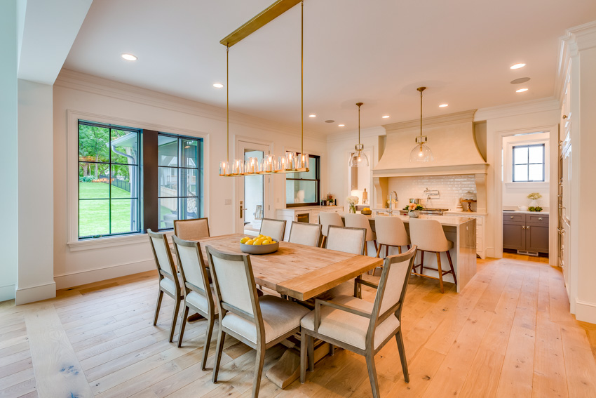 Room with bar lights, window and dining set