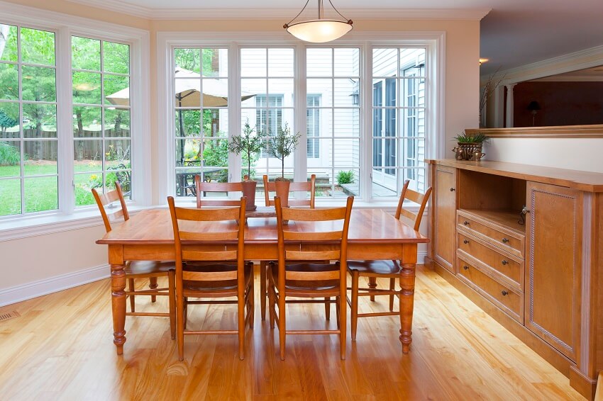 Dining room with French windows, dining set and cabinet