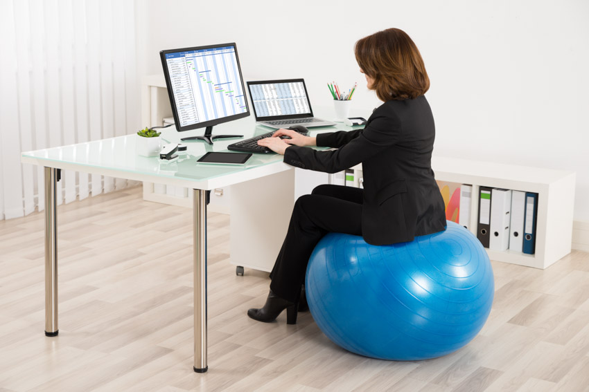 Exercise ball as office chair wood floor computer