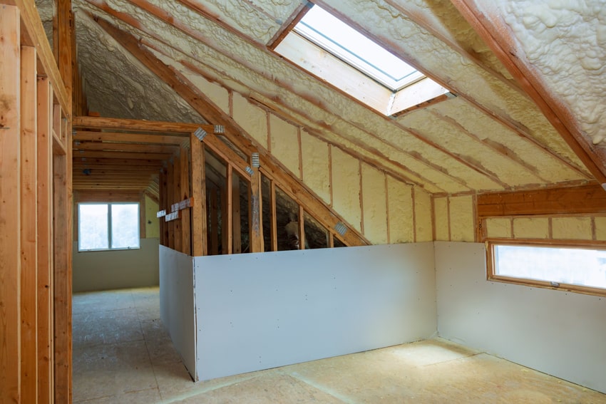 Exposed attic ceiling with blow in insulation