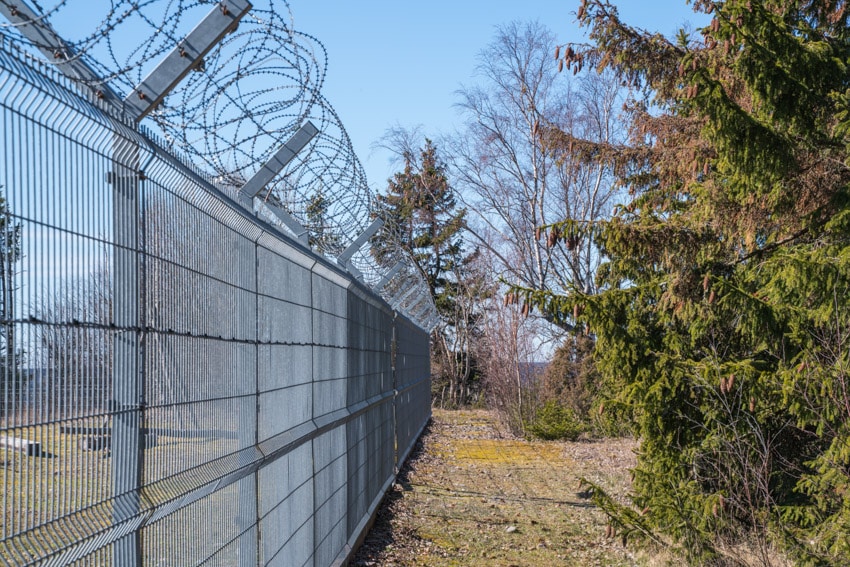 Fence with barbed wire