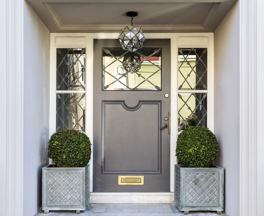 Front door and windows with a grand entryway 