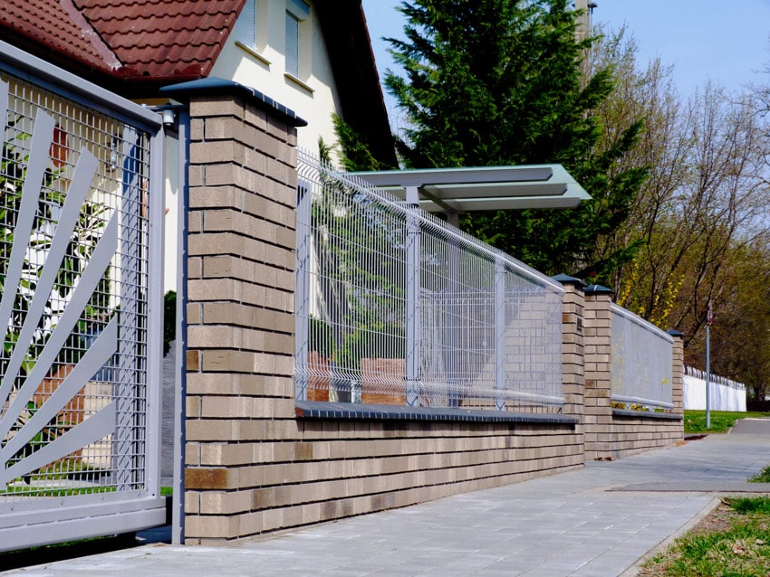 Galvanized wire fence brick wall house exterior