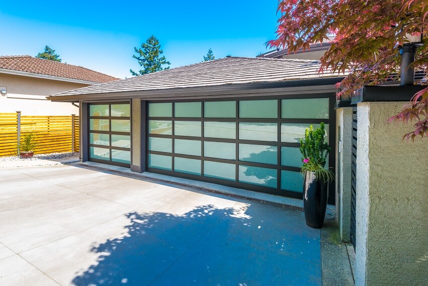 Garage with wide long paved driveway