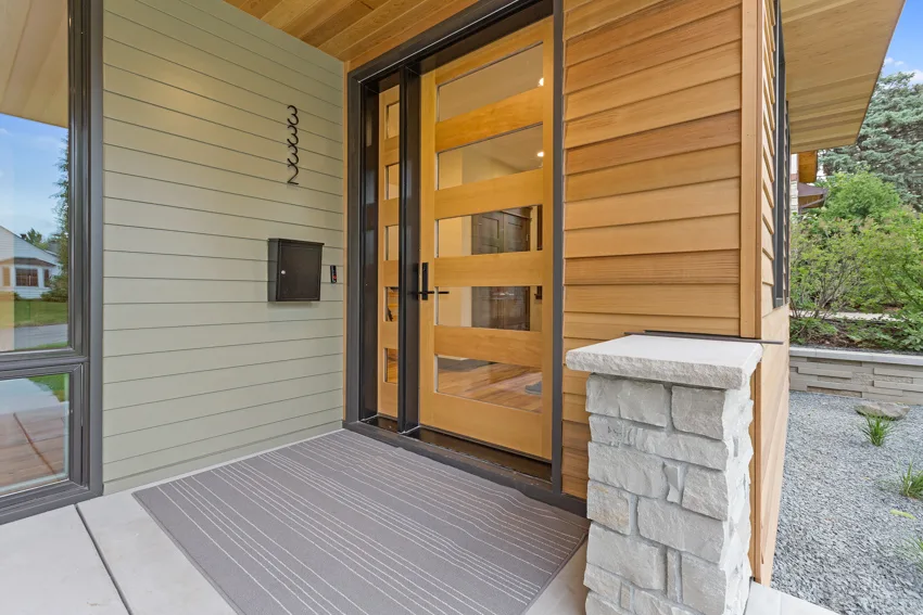 Glass door with wooden siding