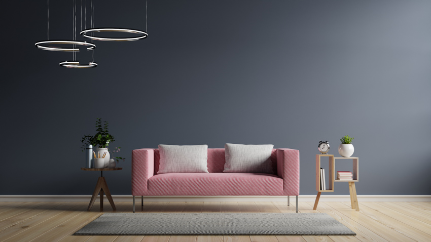 Gray wall pink couch wood floor