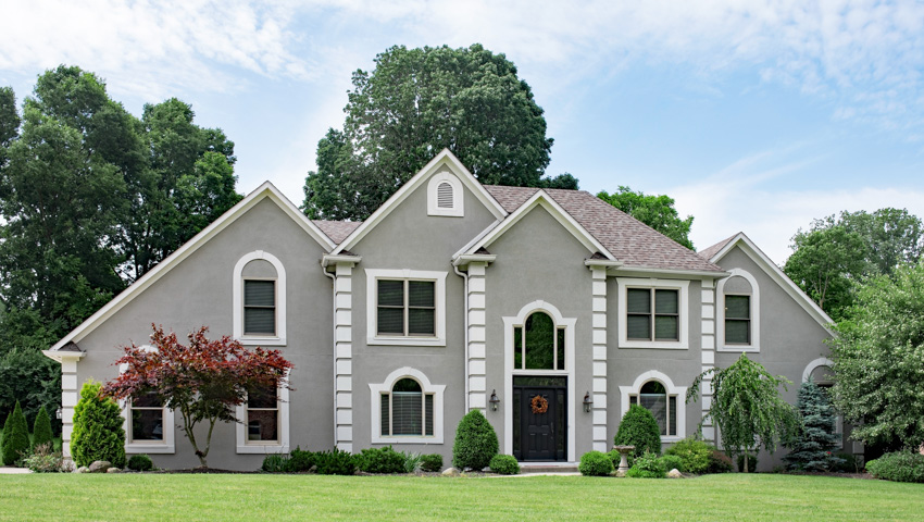 Grey home exterior with stucco