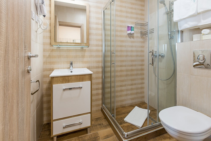 Hotel bathroom interior with shower cabin