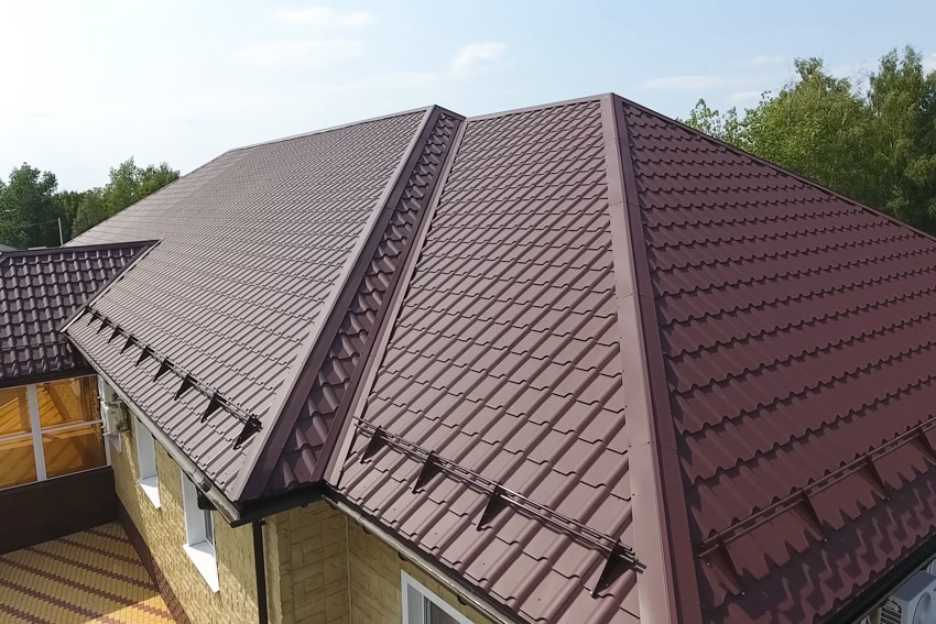 House exterior with maroon metal roofing sheets