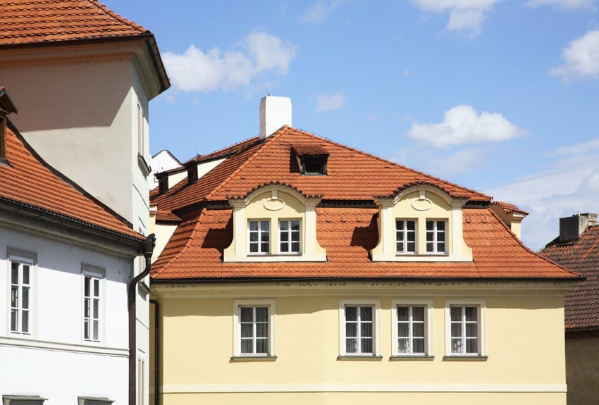 Exterior with orange roof dormers