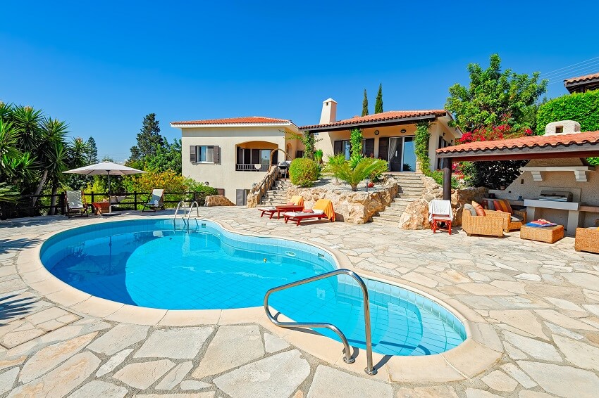Private swimming pool and patio area outside villa