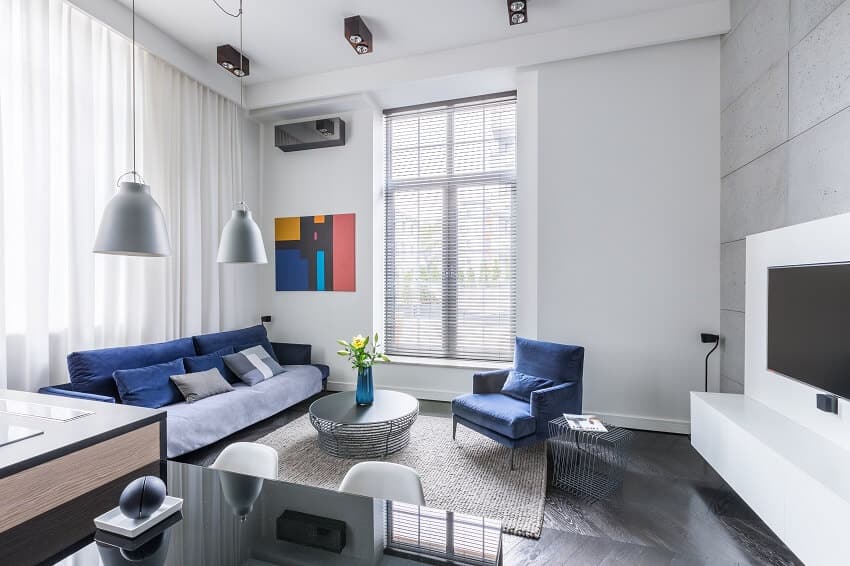 Industrial design in living room with tv and blue furniture set