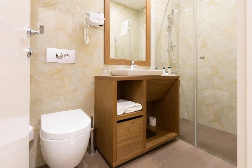 Interior of a hotel bathroom with toilet and shower