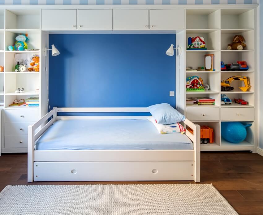 Kid's room in a modern style with a white bed with side rails