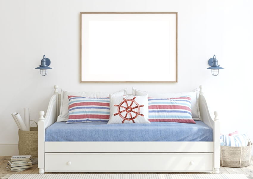 Kid's room in coastal style with daybed near white wall