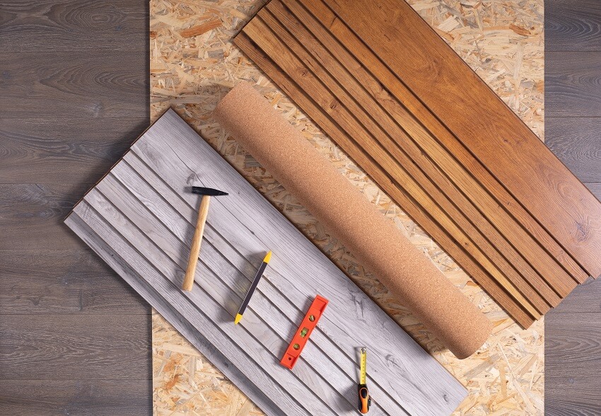 Laminate floor and tools as wood background texture wooden laminate floor plank with copy space