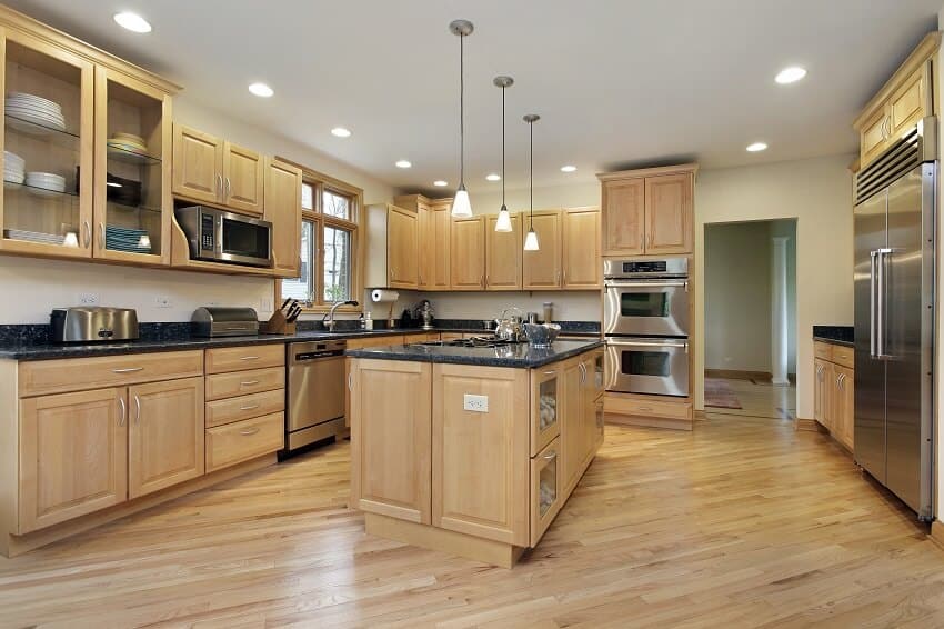 Large kitchen in upscale home with maple wood cabinetry 