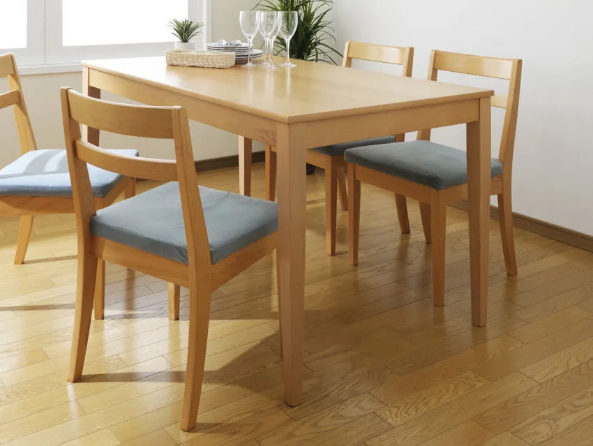 Light wood constructed table, wooden flooring in dining area