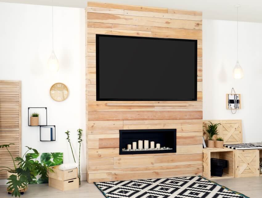 Bautiful living room interior with modern tv on tongue and groove wooden wall