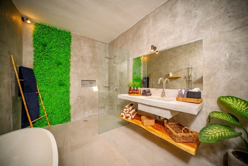 Luxury modern bathroom with polished concrete stucco walls and some green brown accents