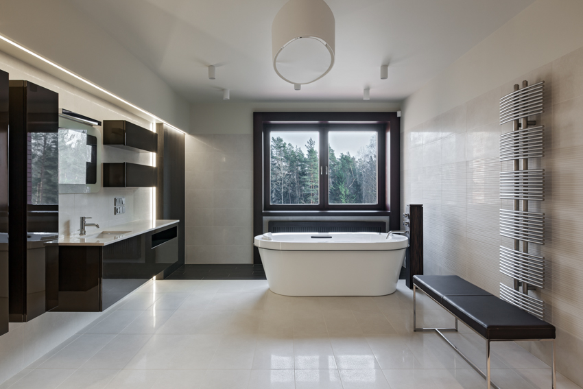 Modern bathroom with black vinyl windows bathtub tile flooring mirror sink countertop bench