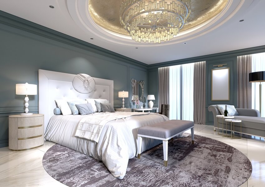 Modern design of master bedroom with a large white bed and a stool with a dressing table nearby