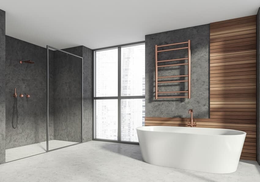 Luxe bathroom interior with ceramic bathtub shower cabin