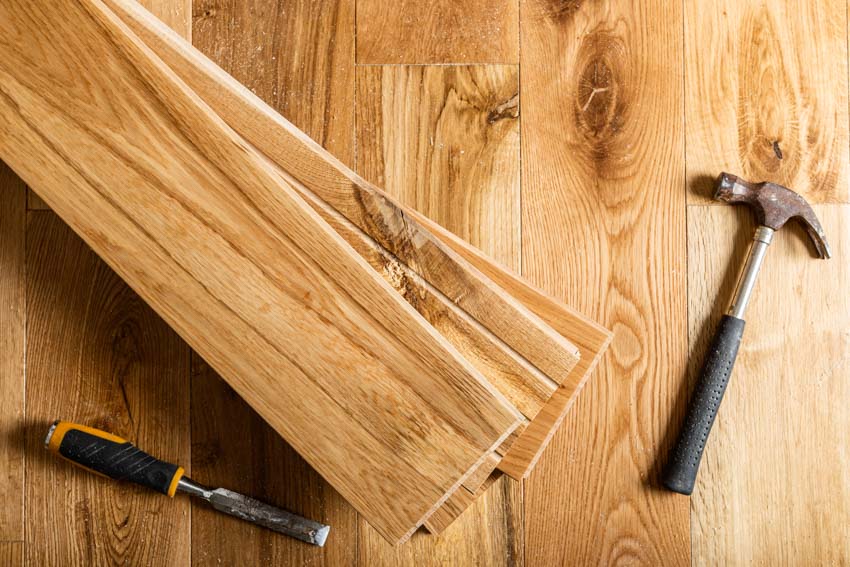 Floor planks with handyman tools