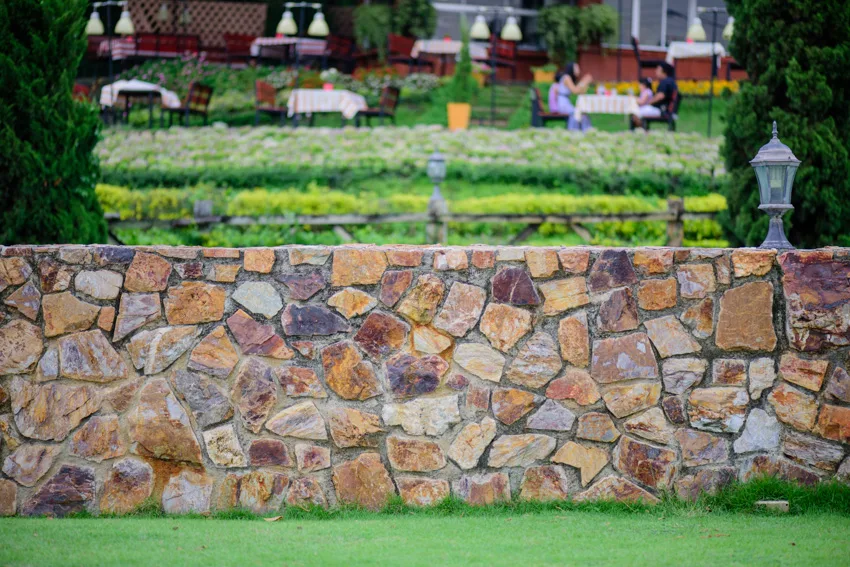 Rocks of different colors and sizes stone wall