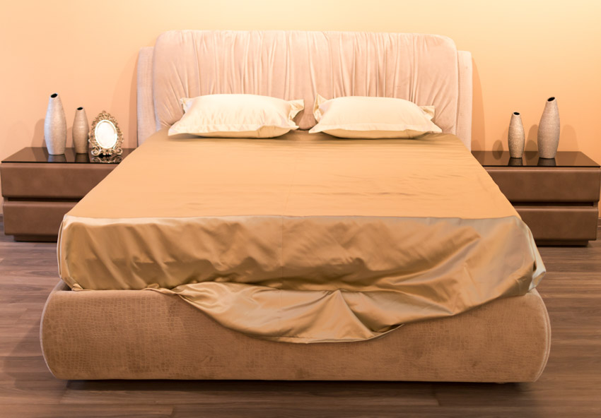 Satin bed sheet wood floor bedroom