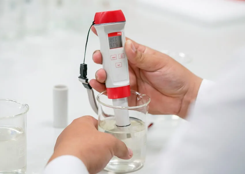 The scientist work at the chemical solution with handle ph meter in the laboratory