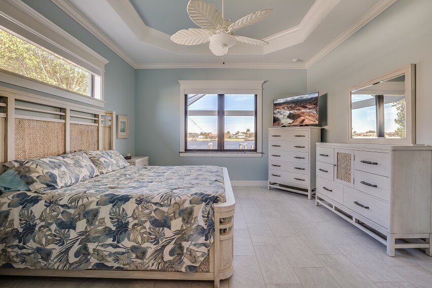 Tray ceiling and awning window in a bedroom