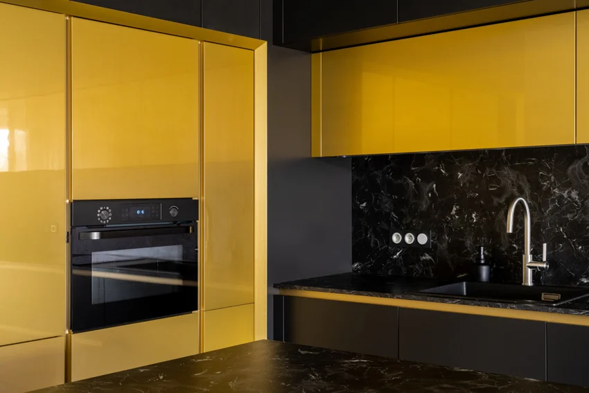 Yellow cabinets black stainless steel oven sink faucet
