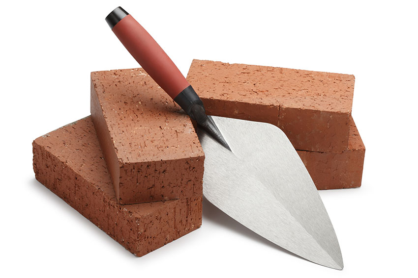 Bricks with masonry trowel